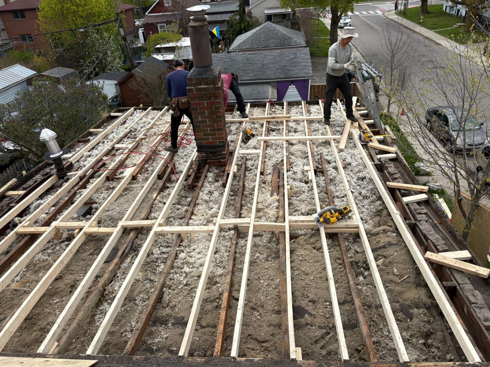 Lakeside’s roofing crew working on the structure beneath a roof